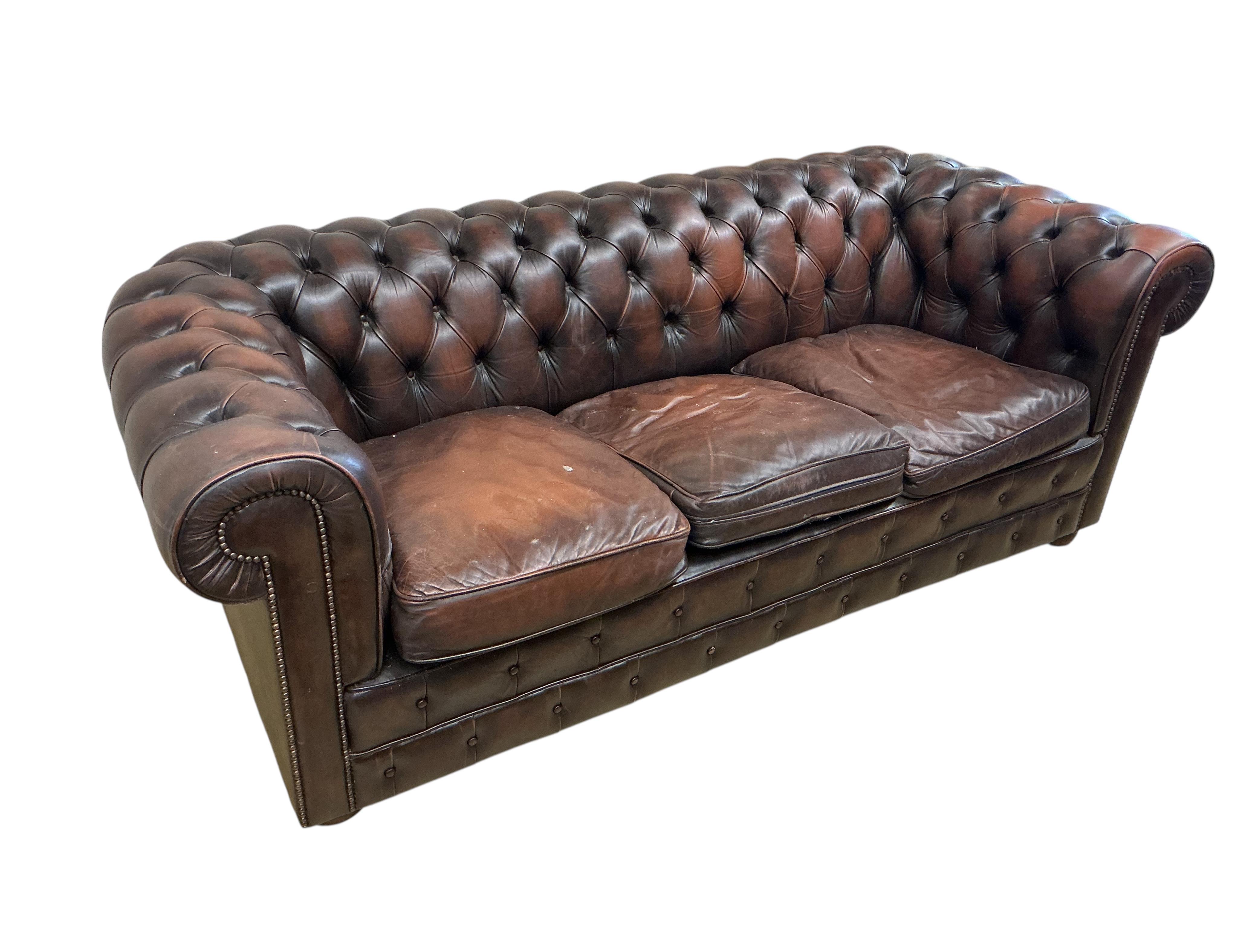A buttoned brown leather three seater Chesterfield settee, width 200cm, depth 86cm, height 73cm